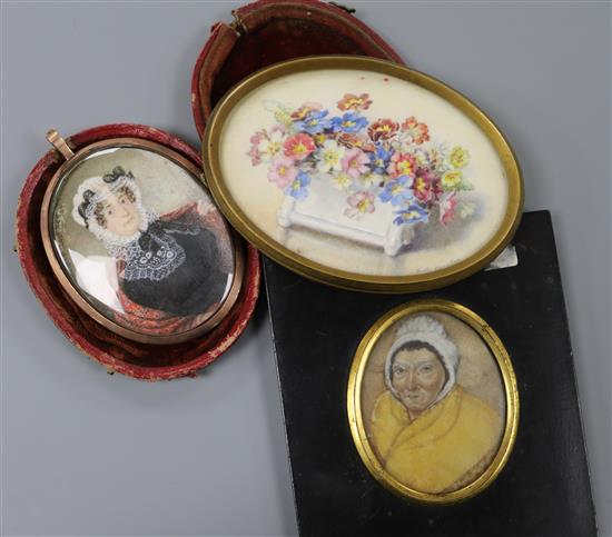 A Victorian oil on ivory miniature of a lady wearing a bonnet, in leather case and two other miniatures